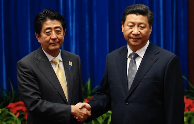 shinzo abe xi jinping handshake apec summit